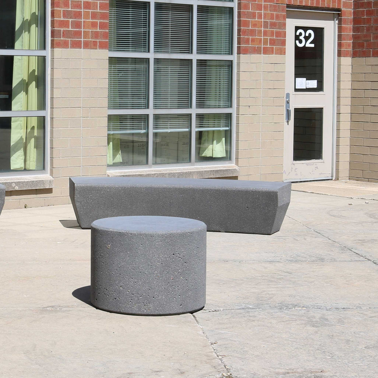LCH-B5726 26" round getzen concrete campus bench with LCH-B5921 curved rectangular concrete campus bench - graphite finish